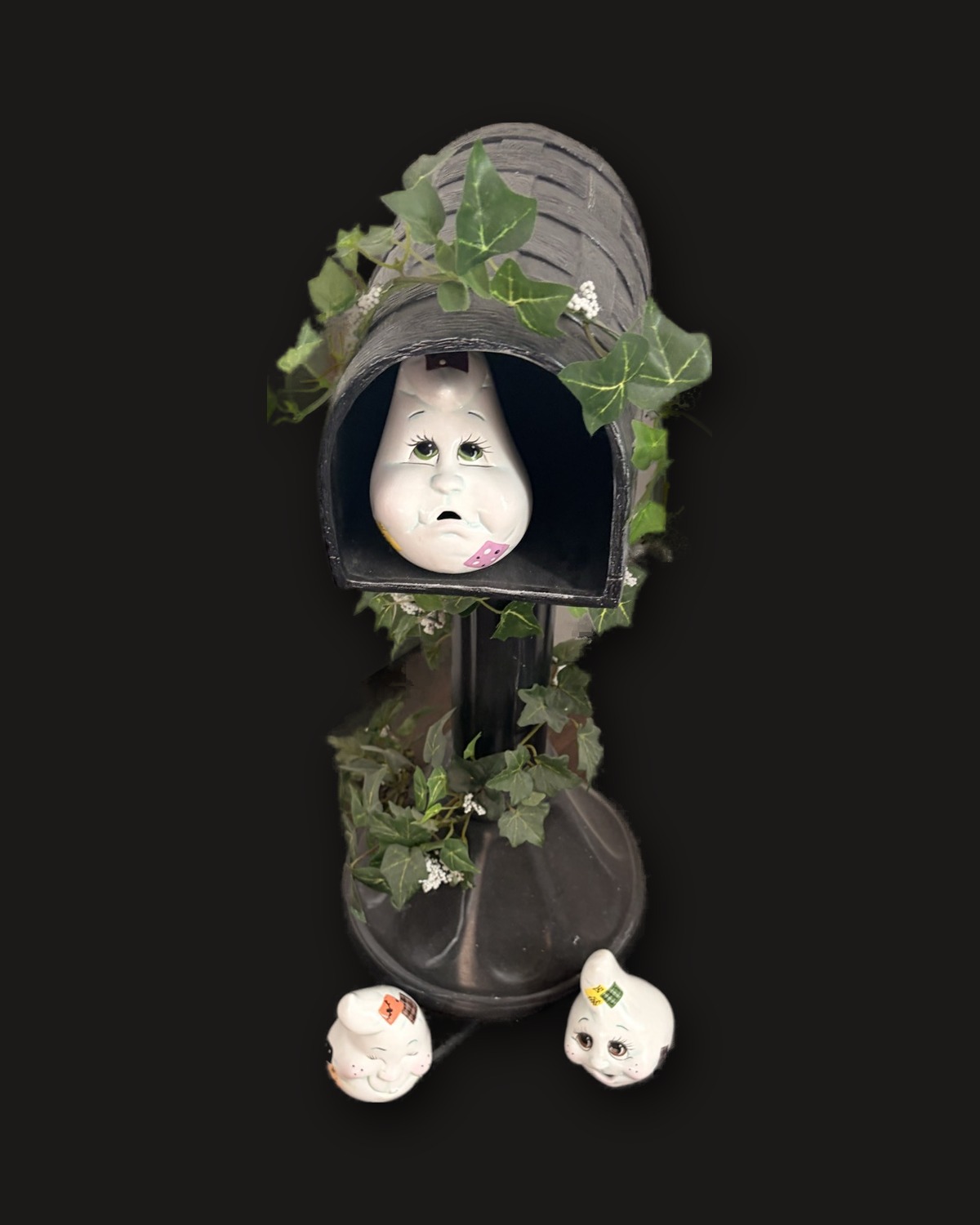 A finished ghost mailbox on black velvet