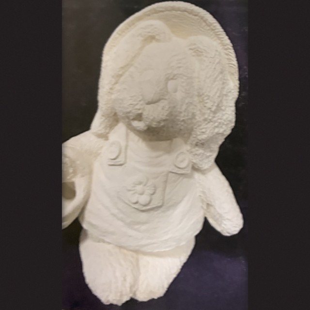 Bunny, number 99, unpainted bisque on black velvet